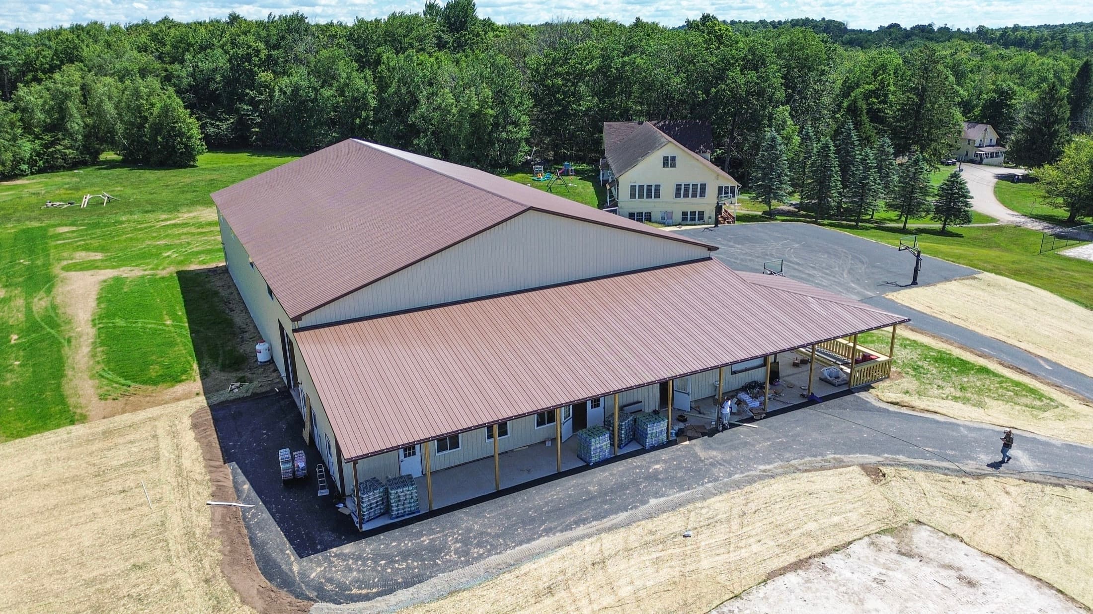 A main building from above and to one side, showing the full run of its covered walkway